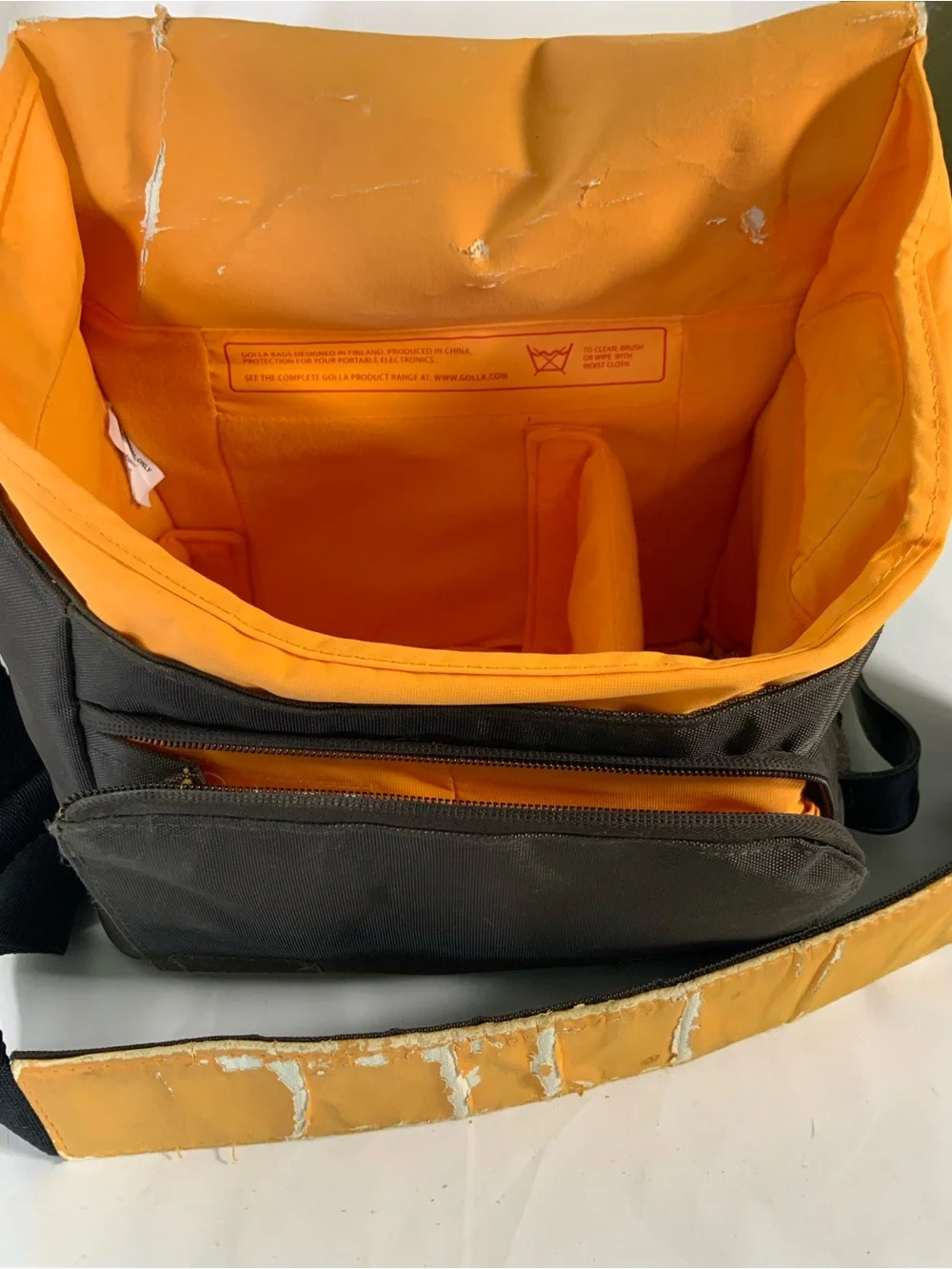 Nikon DSLR Camera with Black Body and Yellow-Orange Interior Bag